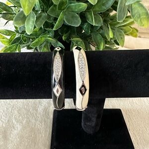 Set of 2 Signed JC Black and White Hinged Style Bangle Bracelets.